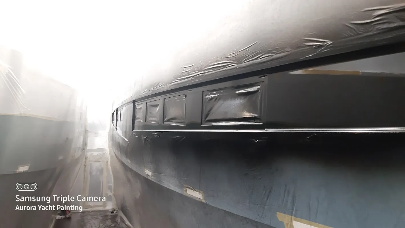 Zeelander yacht hull with repair masking — Aurora Yacht Painting